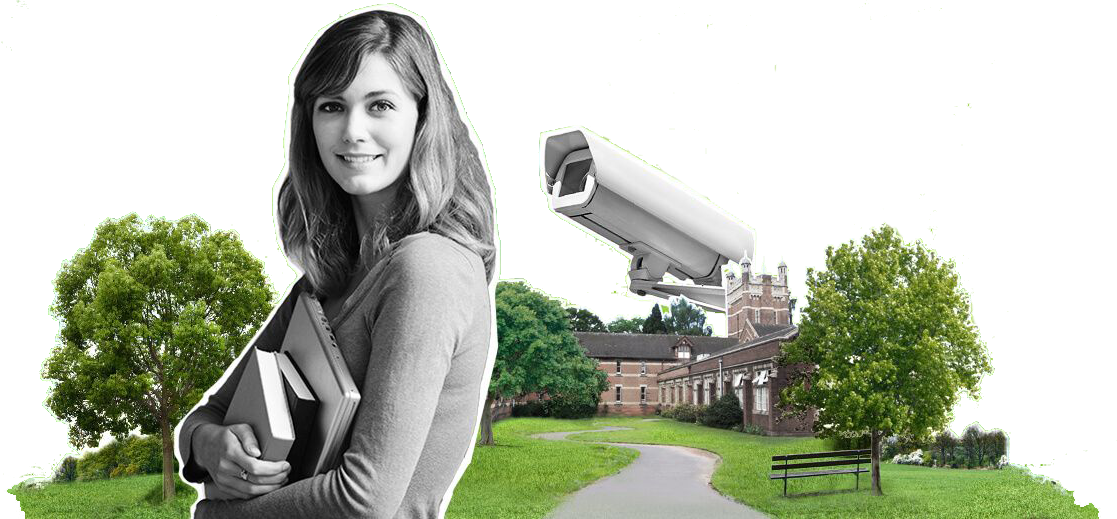 A female student holding textbooks standing in front of Hamstead Campus with a security camera in the background